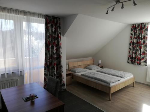 Postel nebo postele na pokoji v ubytování Apartman 25