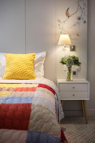 Ένα ή περισσότερα κρεβάτια σε δωμάτιο στο Maison De Camille Boutique Hotel