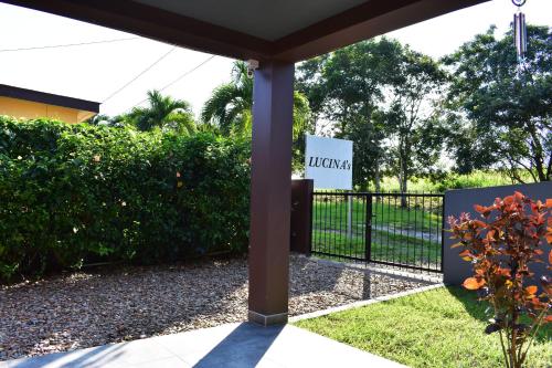 a gate with a sign in front of a fence at Lucina's in San Ignacio