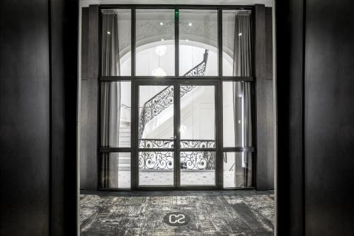 an open door with a view of a staircase at Hotel C2 in Marseille