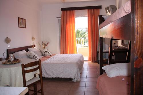 Postel nebo postele na pokoji v ubytování Joy Hotel