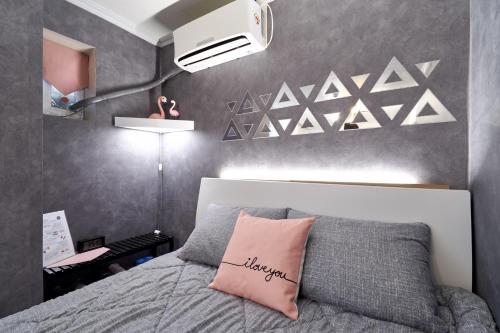 Ένα ή περισσότερα κρεβάτια σε δωμάτιο στο Jun Guesthouse