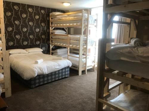 a room with two bunk beds in a room at Boomerang Blackpool in Blackpool