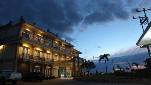 a building at night with a car parked next to it at Padadita Beach Hotel in Waingapu