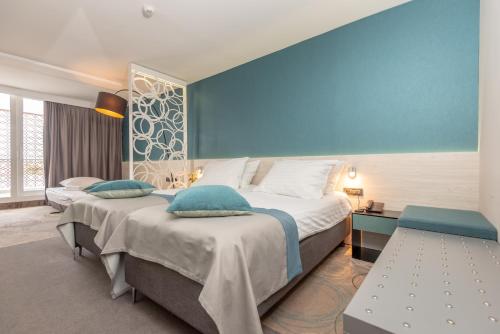 Posteľ alebo postele v izbe v ubytovaní Hotel Kolovare