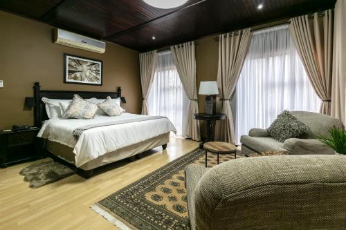A bed or beds in a room at Orchid Luxury Boutique Guesthouse