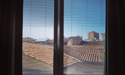 a view of a city from a window at Apartment Giotto Eremitani in Padova