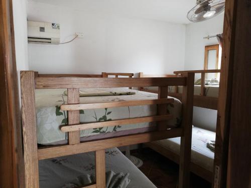 a couple of bunk beds in a room at Casa Madrigueña in Rincón