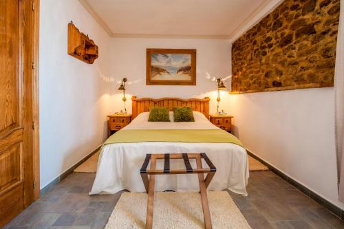 Cama o camas de una habitación en Hostal El Asturiano