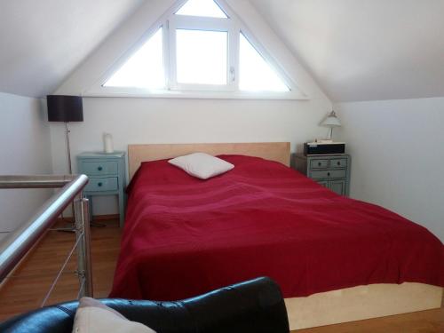 Postel nebo postele na pokoji v ubytování Bootshaus am See