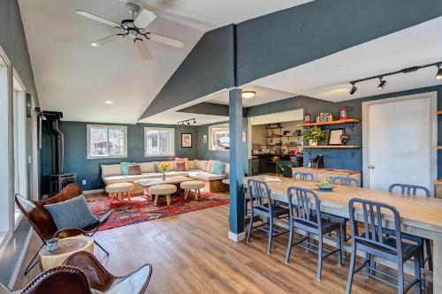a living room with a large table and chairs at Loyal Duke Lodge in Salida