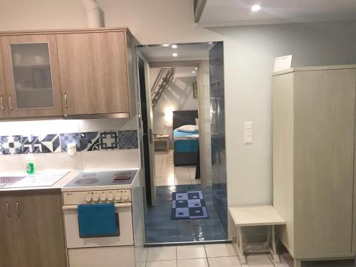 Kuchyňa alebo kuchynka v ubytovaní Odyssey Apartment