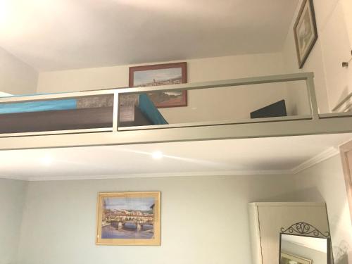 a bunk bed in a room with a mirror at Odyssey Apartment in Palaiochóra
