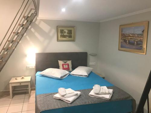 Posteľ alebo postele v izbe v ubytovaní Odyssey Apartment