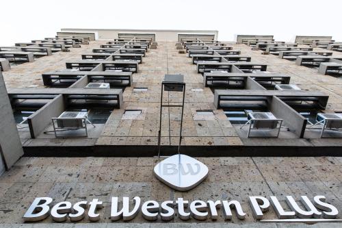 a building with a sign that reads best western plus at Best Western Plus Gran Hotel Centro Historico in Guadalajara