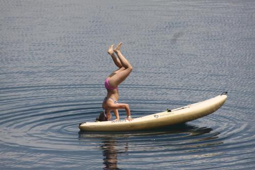 a figurine of a woman on a surfboard in the water at San Simian Lodge in La Laguna