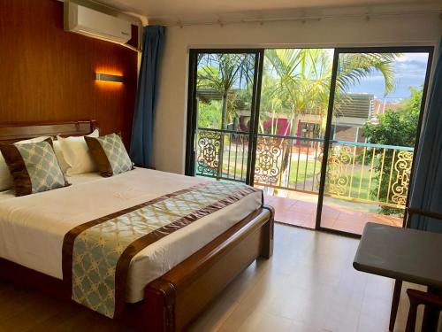 Ένα ή περισσότερα κρεβάτια σε δωμάτιο στο Oxley Motor Inn