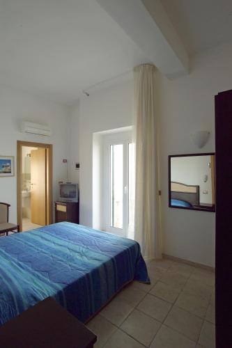 Postel nebo postele na pokoji v ubytování Le Antiche Porte
