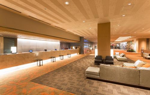 a lobby of a hotel with a waiting room at Keio Plaza Hotel Sapporo in Sapporo