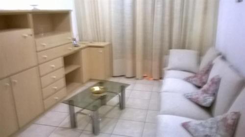 a small living room with a couch and a table at Angolo Tranquillo in Siano