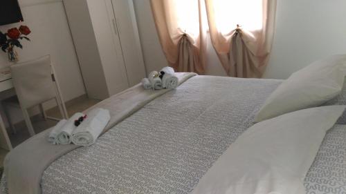Postel nebo postele na pokoji v ubytování B&B Pian del Lago