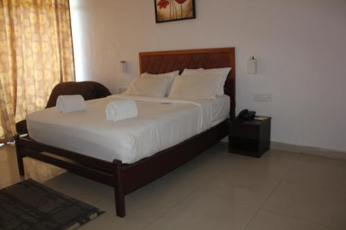 Postel nebo postele na pokoji v ubytování The Cliff Resort, Munnar