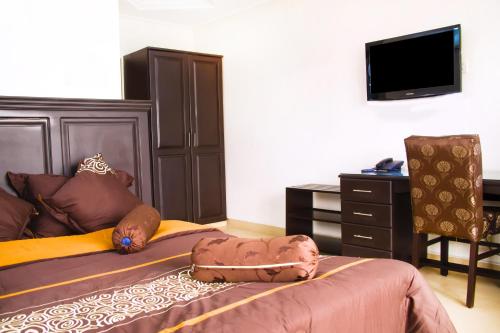 Télévision ou salle de divertissement dans l'établissement Sleep Inn Hotel - Kariakoo