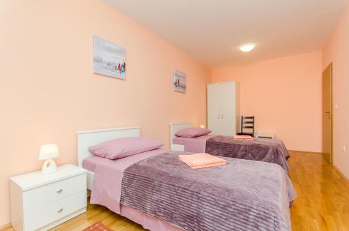 Ένα ή περισσότερα κρεβάτια σε δωμάτιο στο Apartman Ivan