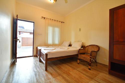 Ένα ή περισσότερα κρεβάτια σε δωμάτιο στο Cherai Onetree Retreat
