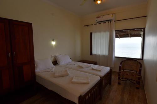 Ένα ή περισσότερα κρεβάτια σε δωμάτιο στο Cherai Onetree Retreat