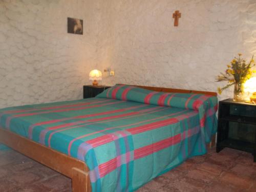 A bed or beds in a room at I Dammusi del Blu Green