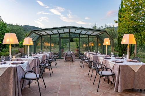 a set of tables and chairs at a wedding at Villa Borgo San Pietro in Cortona