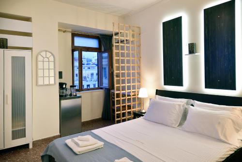 Posteľ alebo postele v izbe v ubytovaní Nikolas Rooms