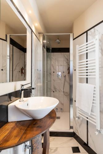 a bathroom with a sink and a shower at Meb in Riomaggiore