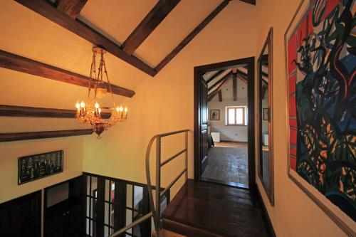 a hallway in a house with a chandelier at Villa Anica Dubrovnik - luxurious with a sea view in Dubrovnik