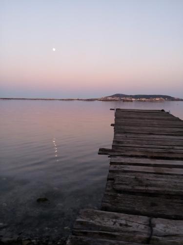 a dock on a body of water at sunset at BoHémian Studio in Sète Center in Sète