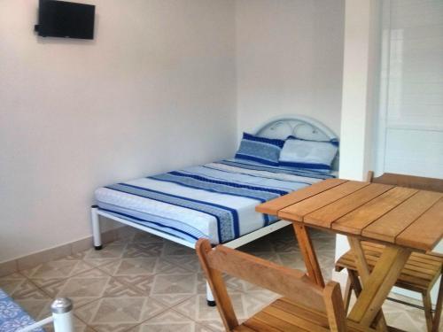 Postel nebo postele na pokoji v ubytování Estúdio em maresias com ar condicionado e piscina
