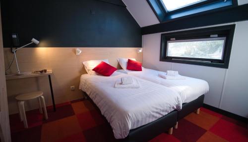 
Un ou plusieurs lits dans un hébergement de l'établissement Hotel Aquatel
