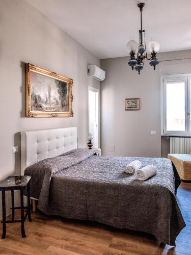 a bedroom with a bed with two pillows on it at Armonia in Salerno