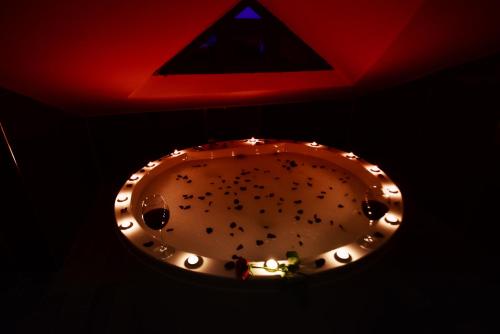 a cake with lights on top of it next to a red ceiling at EL NAZAR STONE SUİTE in Uchisar