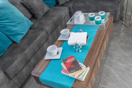 a coffee table in front of a couch at Marimar villa in Protaras