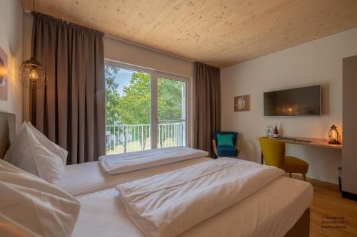 Voodi või voodid majutusasutuse Hotel Katamaran toas