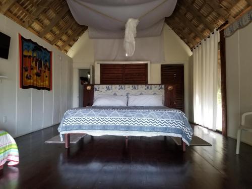 Giường trong phòng chung tại Playa Paraiso en Magante