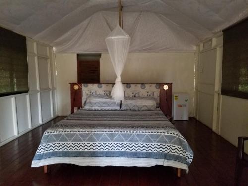 
Ein Bett oder Betten in einem Zimmer der Unterkunft Playa Paraiso en Magante
