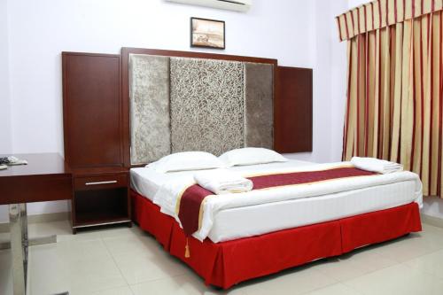 Кровать или кровати в номере Horizon Hotel Apartments - الأفق للشقق الفندقية