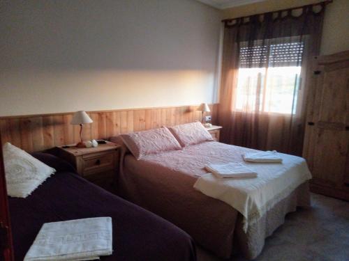 Posteľ alebo postele v izbe v ubytovaní Apartamentos La Presa