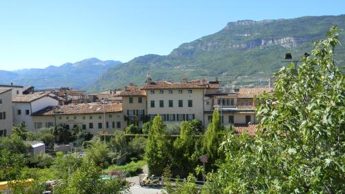 a group of buildings in front of a mountain at B&B Ai Colli in Rovereto