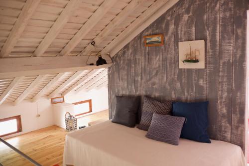 a bedroom with a bed in a room at #Areias Houses 9 in Furnas