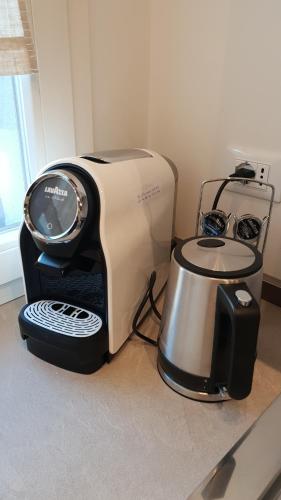 a toaster sitting on a counter next to a blender at homesweethome venice in Venice