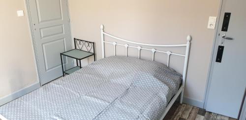 Ένα ή περισσότερα κρεβάτια σε δωμάτιο στο La chambre des cht'is